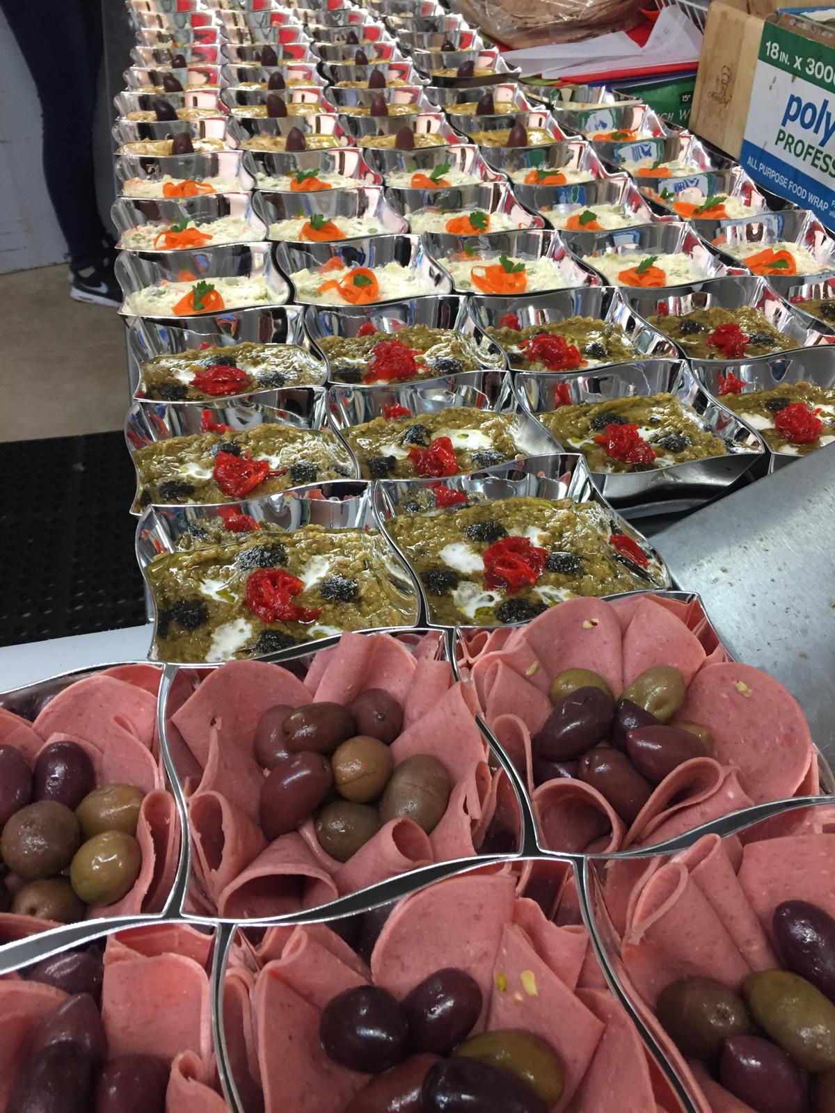 Individual appetizer portions with olives and dips